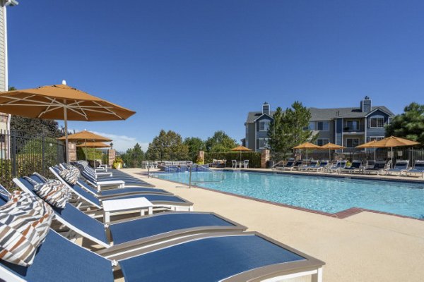 Resort-style pool with lounging area at Avana Eastlake Apartments