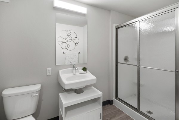 Elegant bathroom with modern fixtures at Cooper George Apartments
