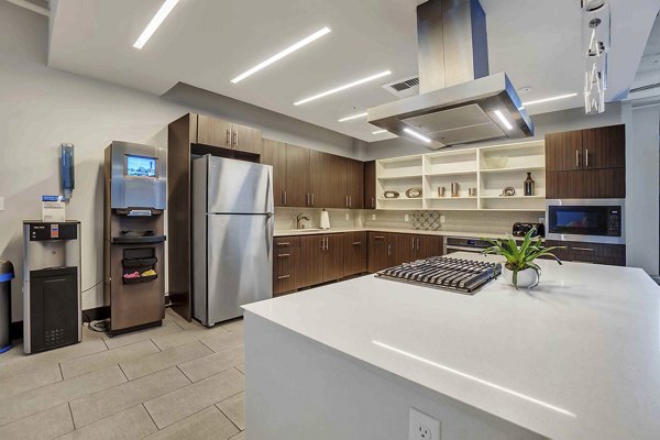 Modern clubhouse with sleek design at Cooper George Apartments featuring cozy seating areas and contemporary decor, perfect for social gatherings