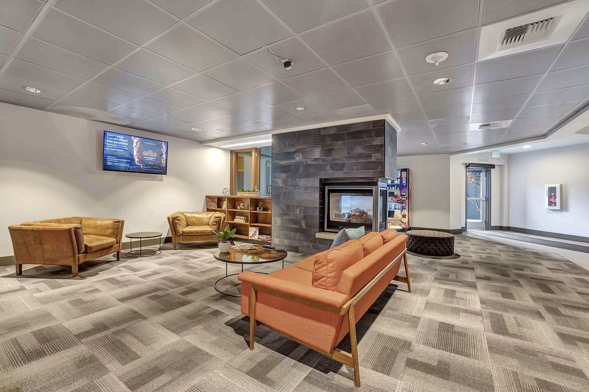 Elegant clubhouse featuring modern decor and cozy seating at Cooper George Apartments