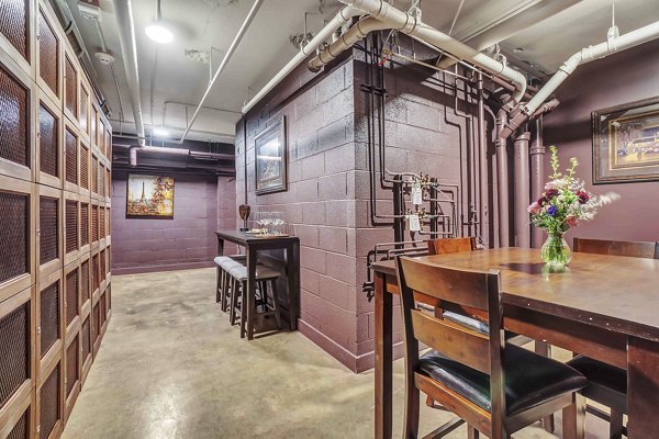 Chic clubhouse with modern seating and billiards at Cooper George Apartments, offering luxury social spaces in bustling downtown