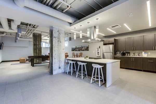 Clubhouse lounge with modern decor and seating at Cooper George Apartments