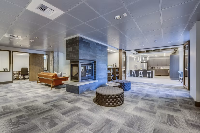 Modern clubhouse featuring billiards and seating areas at Cooper George Apartments, offering luxury living