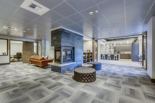 Modern clubhouse featuring billiards and seating areas at Cooper George Apartments, offering luxury living