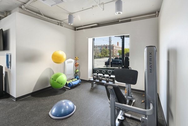 State-of-the-art fitness center with modern equipment at Cooper George Apartments