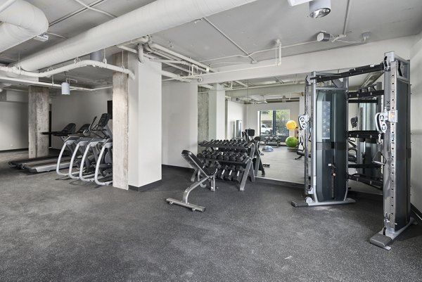 State-of-the-art fitness center with modern equipment at Cooper George Apartments, perfect for a luxury workout experience
