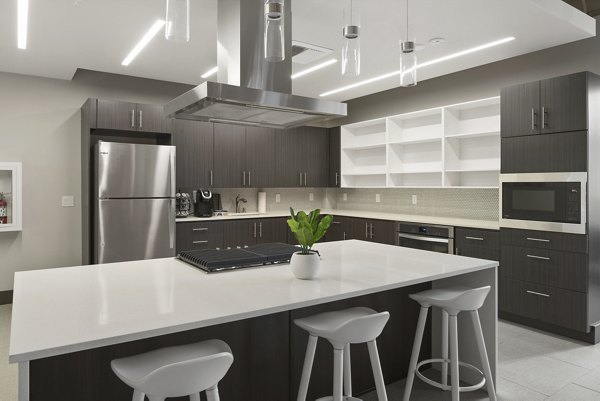 Spacious kitchen with modern appliances in Cooper George Apartments