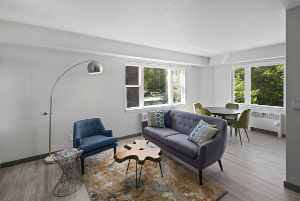 Elegant living room with modern furnishings at Cooper George Apartments