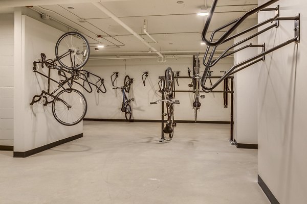 Secure bike storage facility at Cooper George Apartments, ideal for cycling enthusiasts seeking modern amenities in urban living