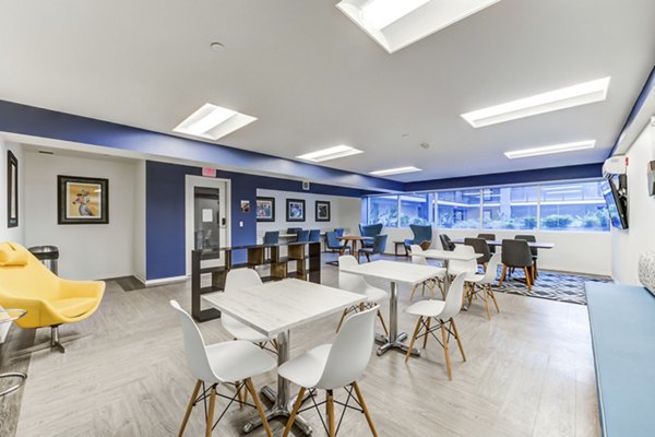 Clubhouse featuring modern design elements at Avana on Pine Apartments, a luxury Greystar property