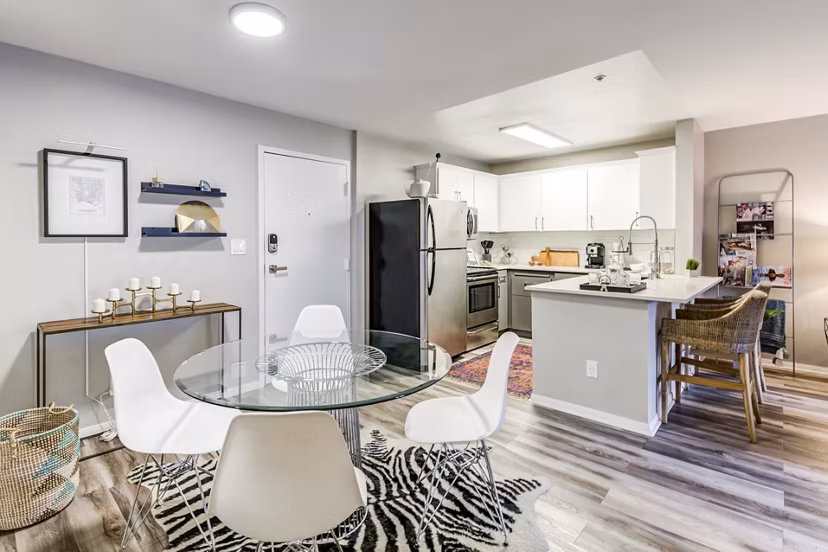 Dining area with modern furnishings at Avana on Pine Apartments