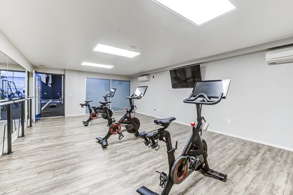 Yoga and spin studio with modern equipment at Avana on Pine Apartments, offering a perfect space for fitness enthusiasts