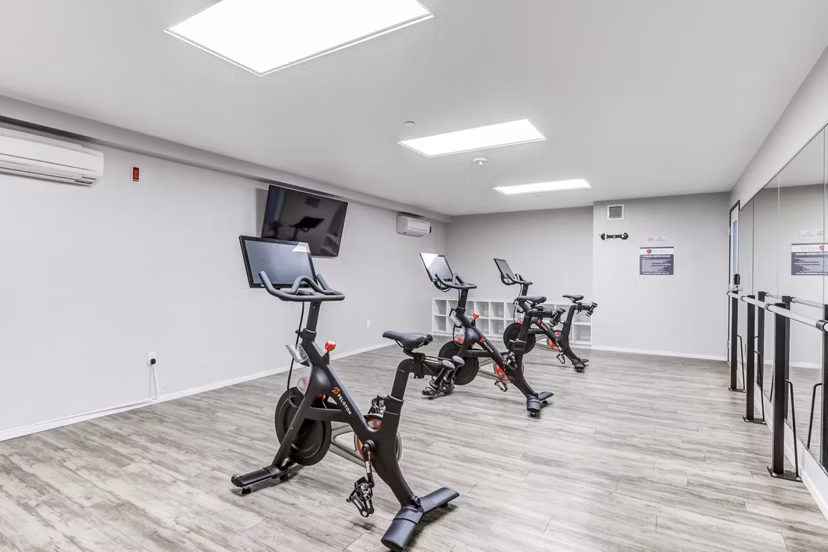 Yoga and spin studio with modern fitness equipment at Avana on Pine Apartments