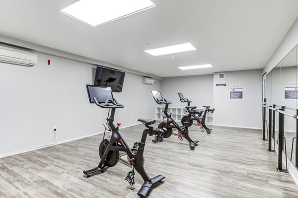Yoga and spin studio with modern fitness equipment at Avana on Pine Apartments