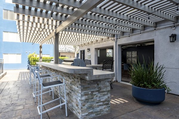 Chic grill area with modern barbeque stations at Avana on Pine Apartments