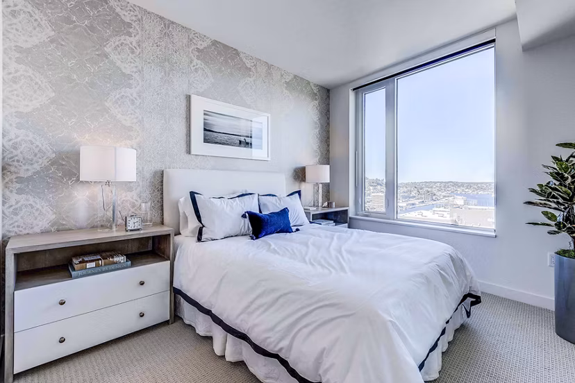 Ascent South Lake Union Apartments: Modern bedroom with stylish furnishings and large windows in downtown Seattle