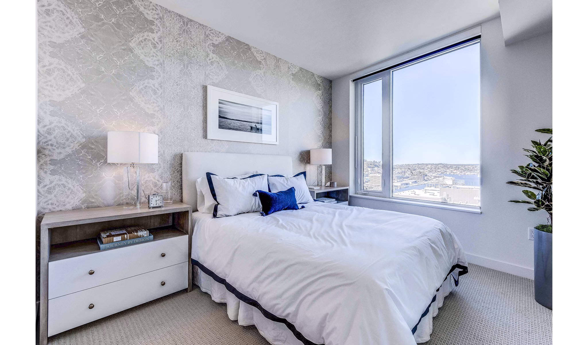Ascent South Lake Union Apartments: Modern bedroom with stylish furnishings and large windows in downtown Seattle