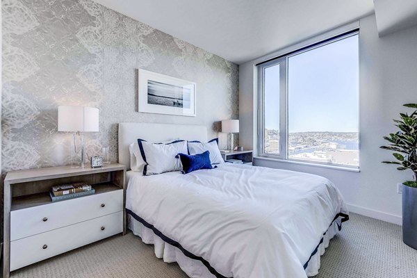 Ascent South Lake Union Apartments: Modern bedroom with stylish furnishings and large windows in downtown Seattle
