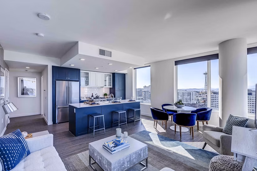 Living room with modern design and ample natural light at Ascent South Lake Union Apartments
