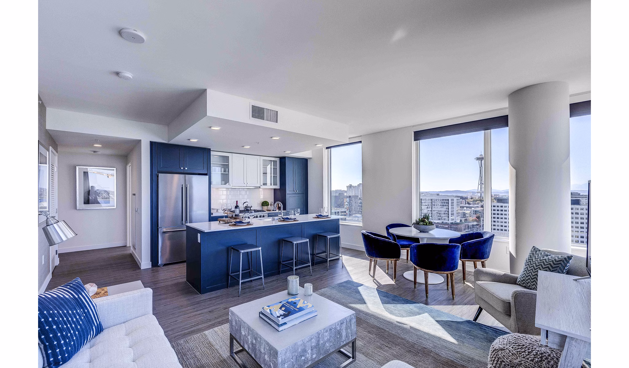 Living room with modern design and ample natural light at Ascent South Lake Union Apartments