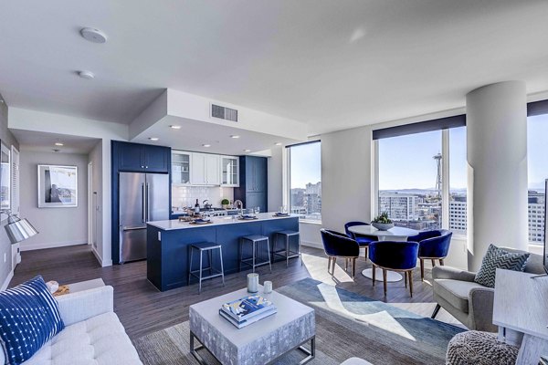 Living room with modern design and ample natural light at Ascent South Lake Union Apartments