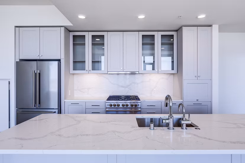 Modern kitchen with stainless steel appliances in Ascent South Lake Union Apartments in Seattle