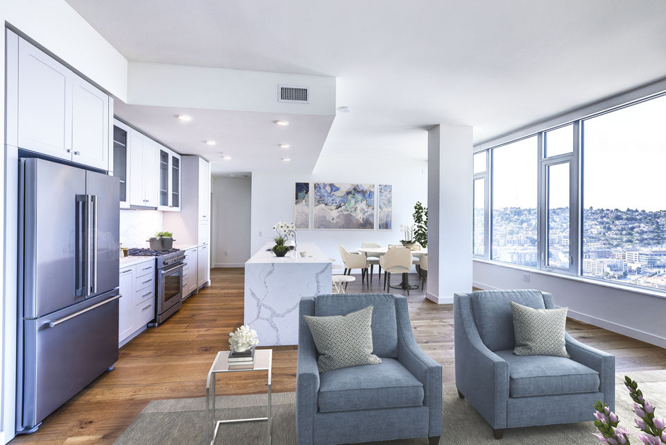 Spacious living room with modern decor and large windows at Ascent South Lake Union Apartments
