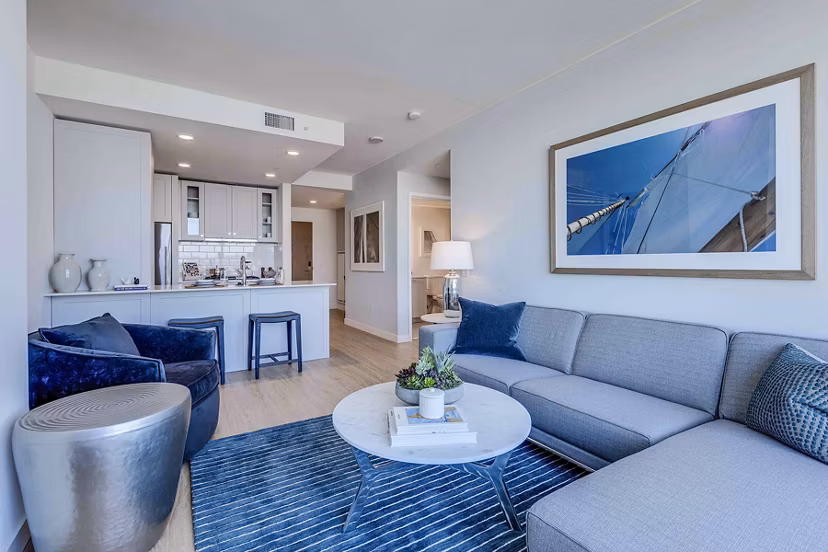Spacious living room with modern decor in Ascent South Lake Union Apartments, offering luxury living in the heart of Seattle