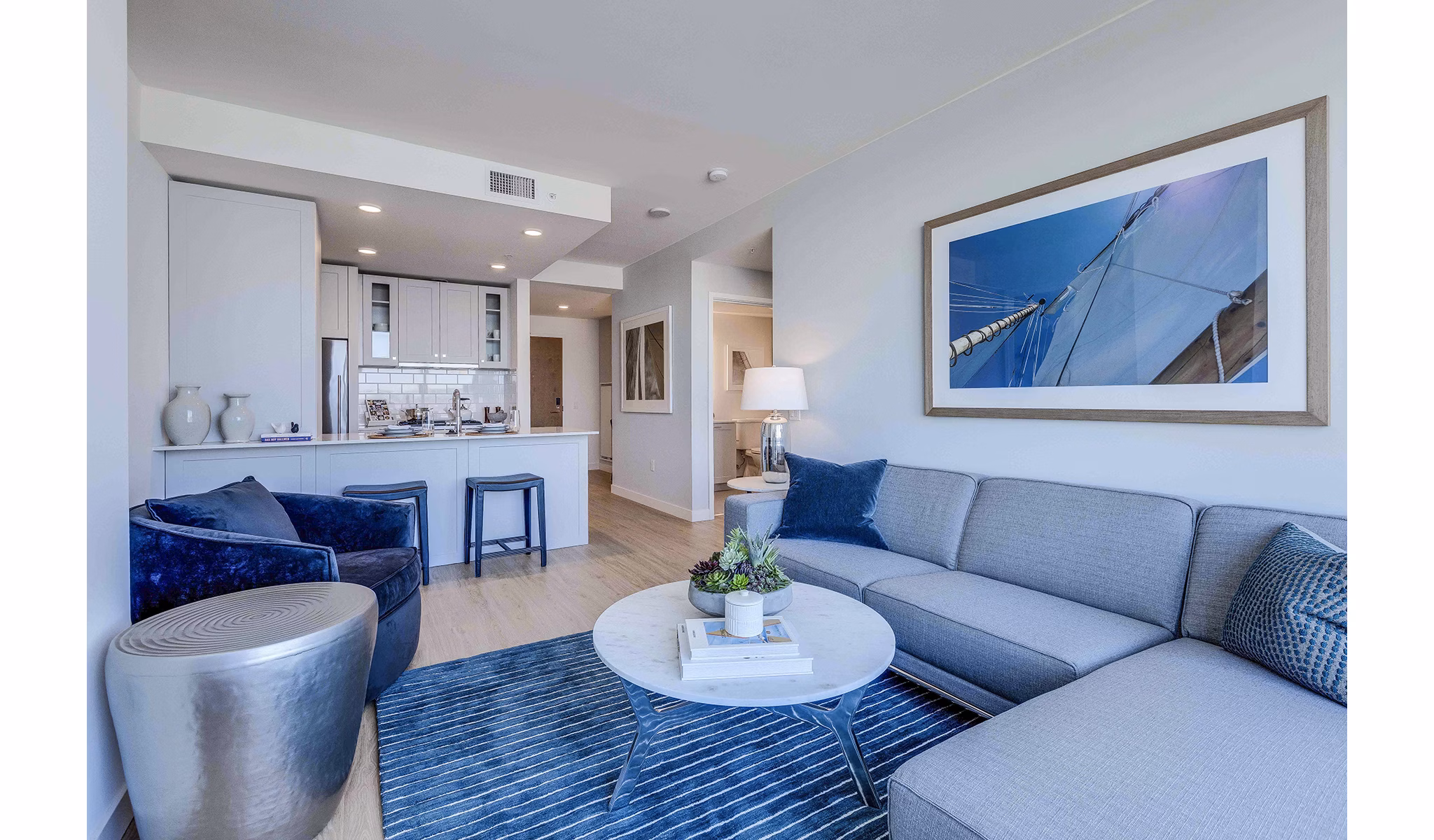 Spacious living room with modern decor in Ascent South Lake Union Apartments, offering luxury living in the heart of Seattle