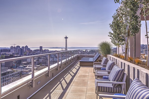 Spacious patio with modern furniture at Ascent South Lake Union Apartments, perfect for outdoor relaxation and luxury living
