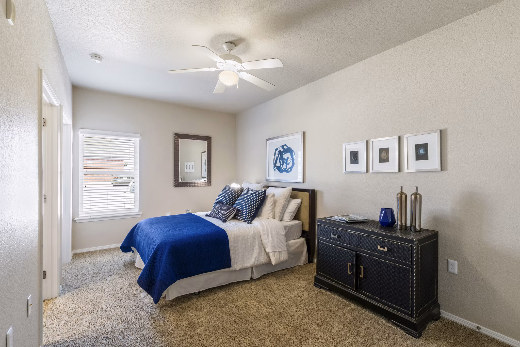 Cozy bedroom with modern decor at Timberlinks at Denton Apartments, offering luxury living spaces tailored for comfort and style