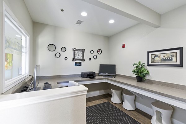Business center featuring modern workstations at Timberlinks at Denton Apartments, ideal for remote work and meetings