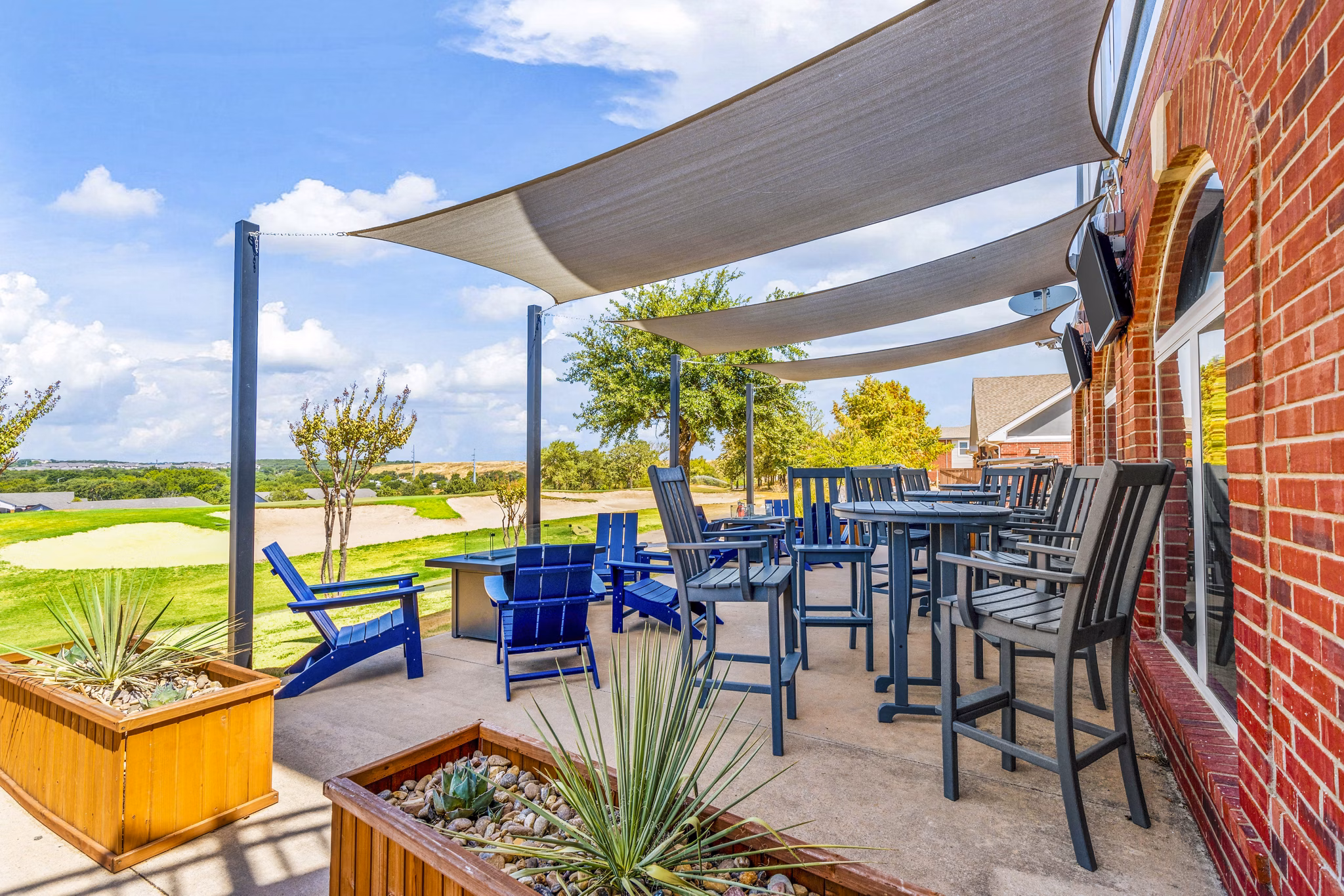 Cozy outdoor fire pit on the patio at Timberlinks at Denton Apartments, perfect for evening gatherings in a stylish community setting