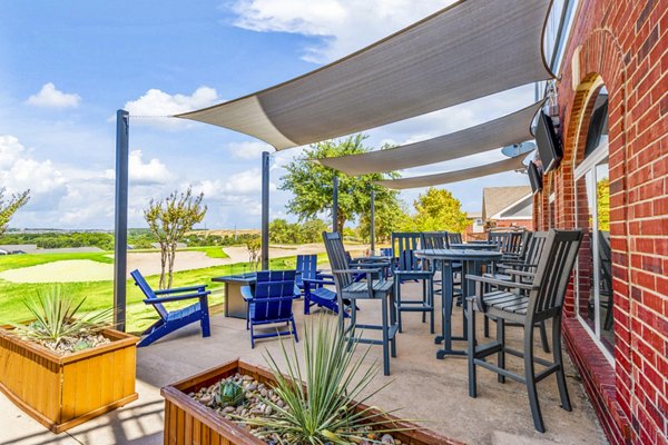 Cozy outdoor fire pit on the patio at Timberlinks at Denton Apartments, perfect for evening gatherings in a stylish community setting