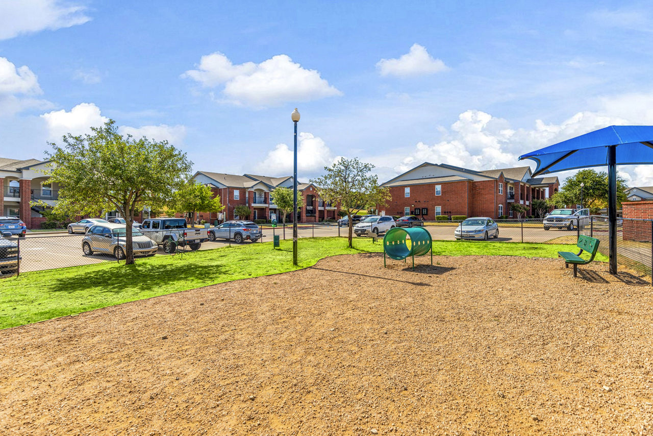 Dog park at Timberlinks At Denton Apartments