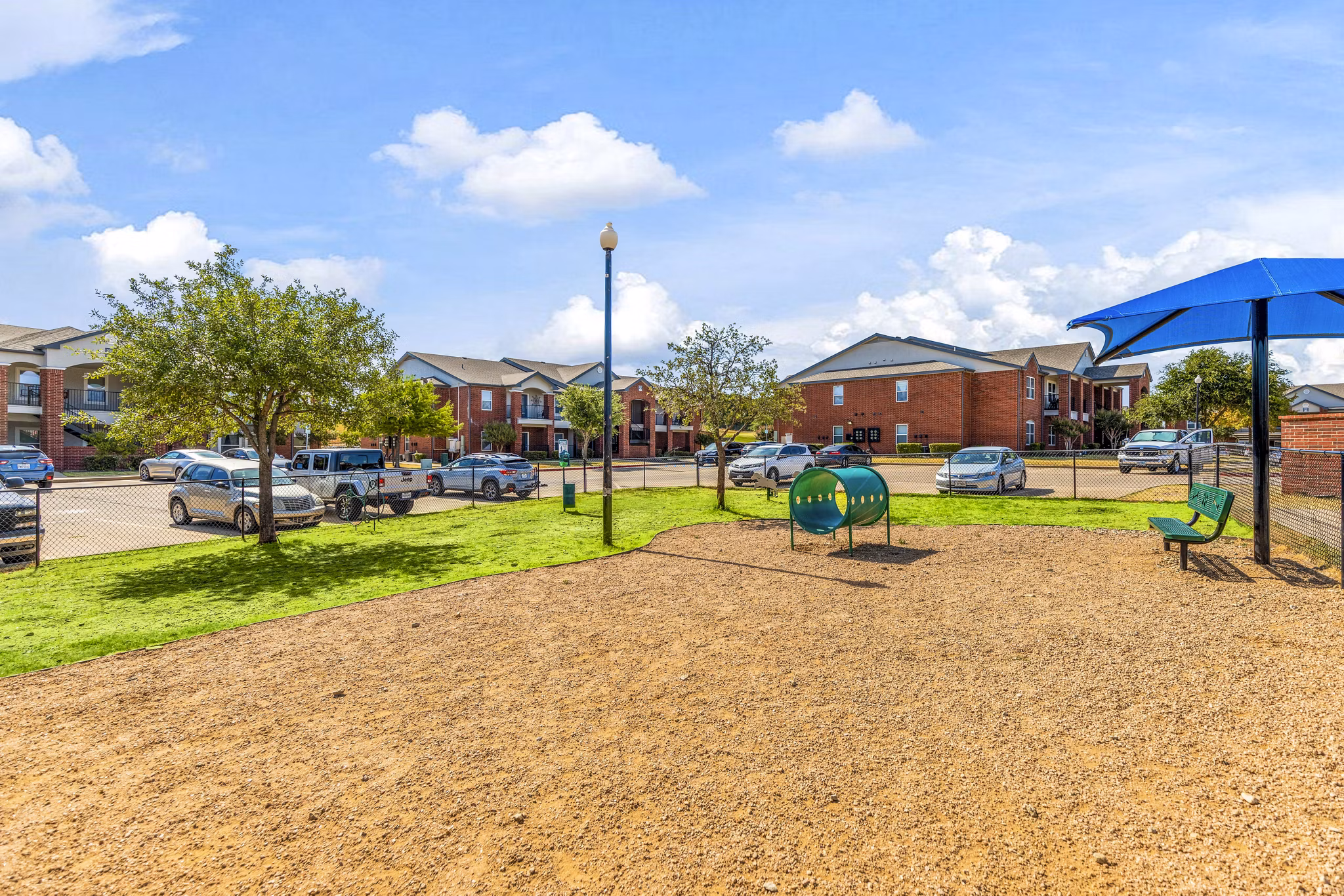 Dog-friendly park with agility equipment at Timberlinks at Denton Apartments