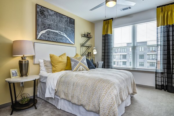 Modern bedroom with elegant decor at One Riverwalk Apartments