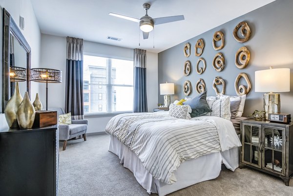 Cozy bedroom with modern decor at One Riverwalk Apartments
