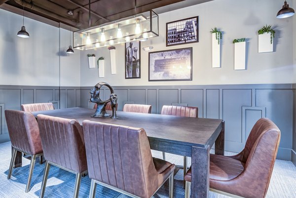 Meeting facility featuring modern design and spacious seating arrangement at One Riverwalk Apartments