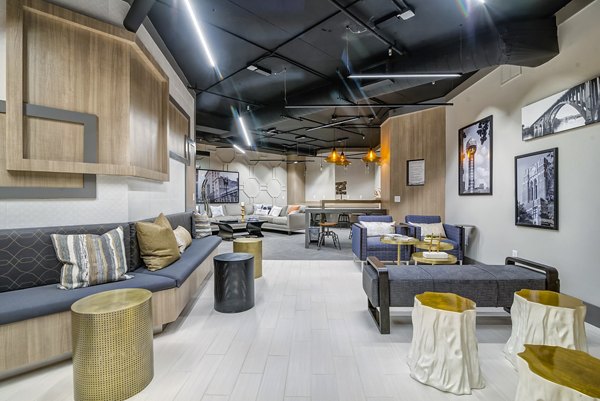 Luxurious clubhouse with modern decor at One Riverwalk Apartments featuring cozy seating and social spaces