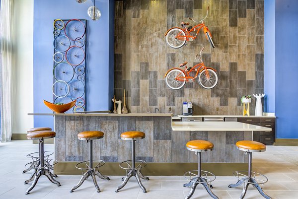 Elegant clubhouse with modern seating at One Riverwalk Apartments, ideal for social gatherings and community events