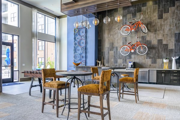 Clubhouse with modern furnishings at One Riverwalk Apartments, offering elegant spaces for social gatherings in a luxury setting