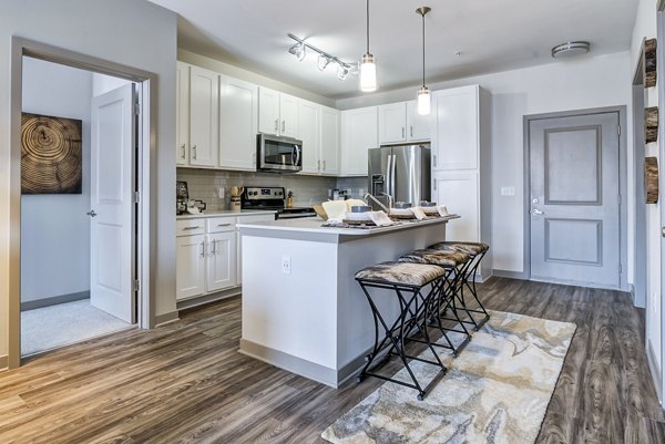 Modern kitchen with stainless steel appliances at One Riverwalk Apartments