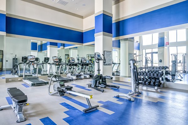 State-of-the-art fitness center with modern equipment at One Riverwalk Apartments
