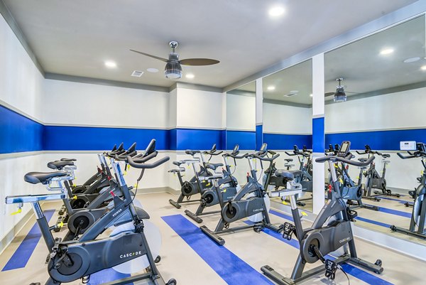 Modern fitness center with state-of-the-art equipment at One Riverwalk Apartments for luxury living