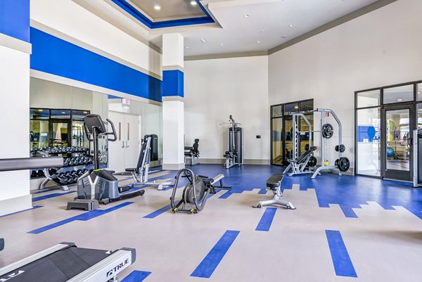 fitness center at One Riverwalk Apartments