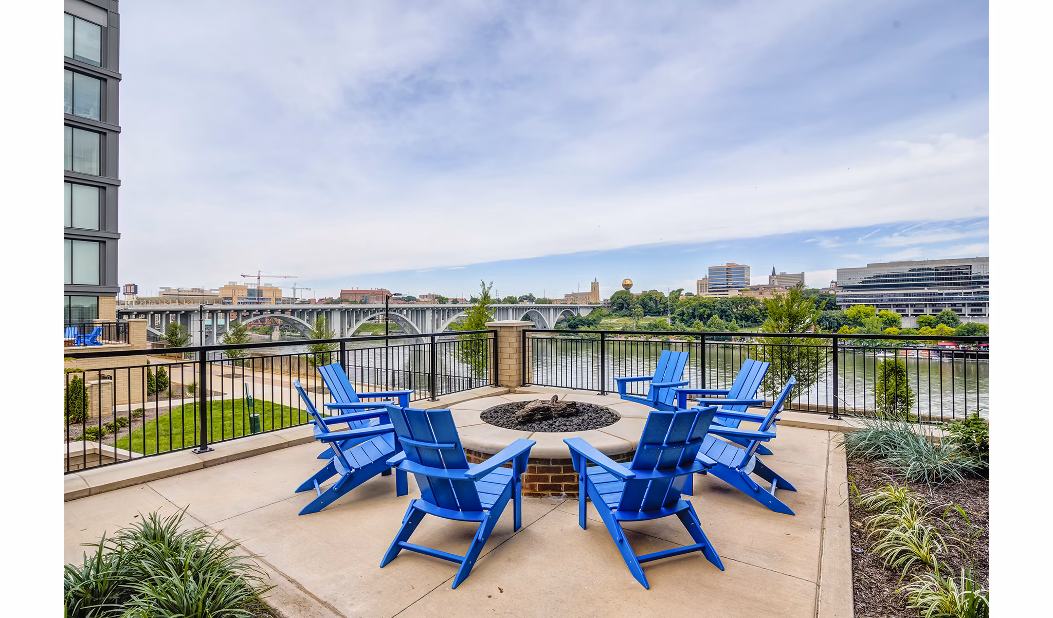 Fire pit area with comfortable seating at One Riverwalk Apartments, a Greystar luxury community, ideal for outdoor gatherings and relaxation