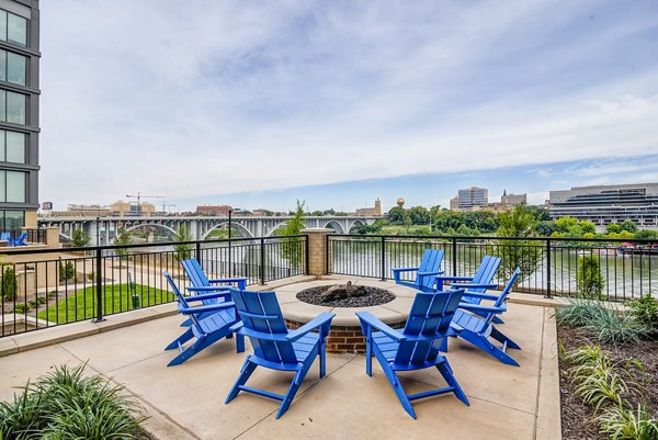 Fire pit area with comfortable seating at One Riverwalk Apartments, a Greystar luxury community, ideal for outdoor gatherings and relaxation
