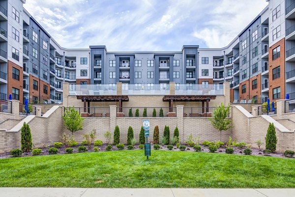 Fenced dog park with agility equipment at One Riverwalk Apartments for playful pet exercise and enjoyment