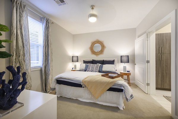 Spacious bedroom with modern furnishings at Everleigh Cape Cod luxury apartments